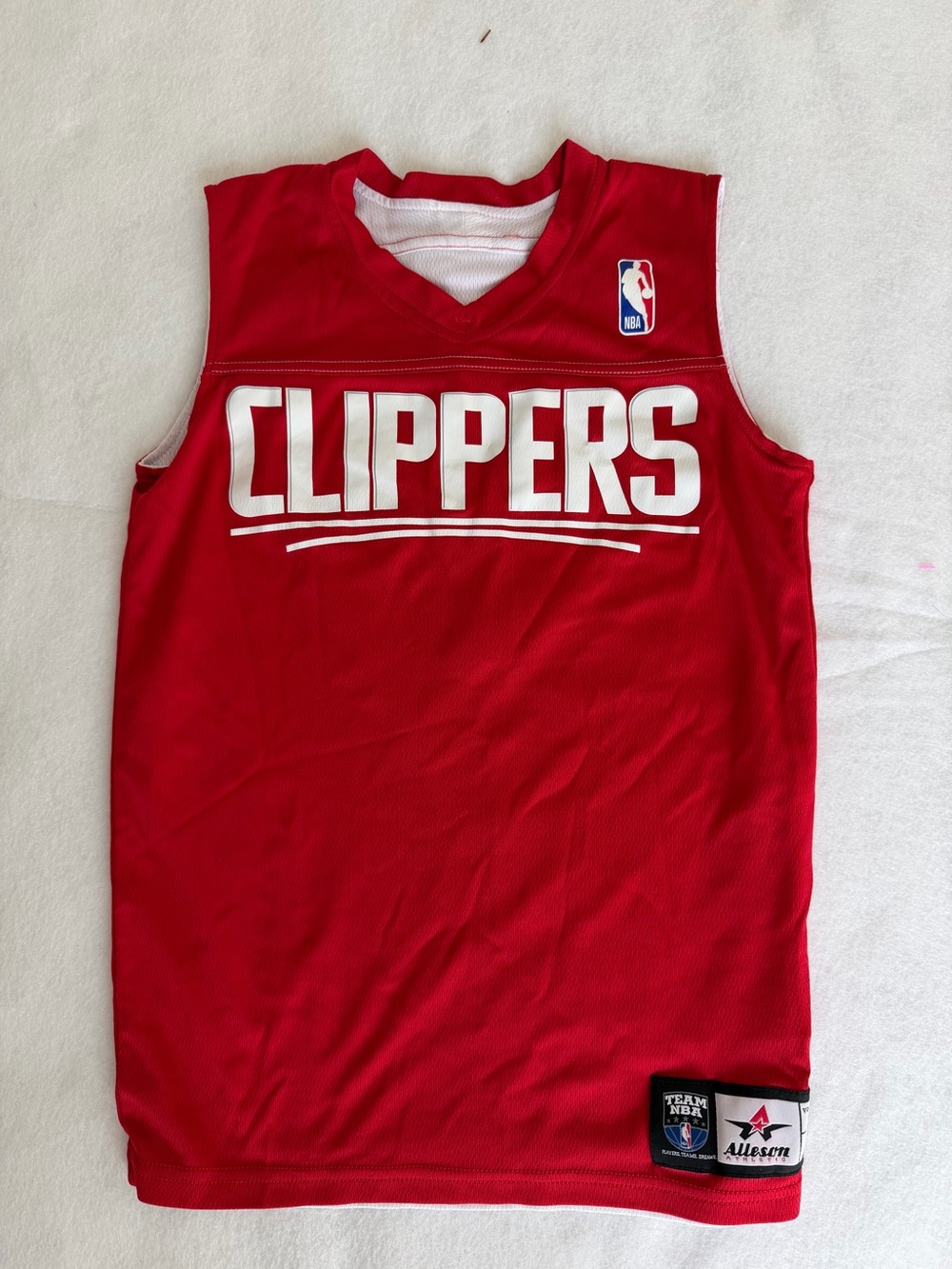 NBA LA Clippers reversible red jersey or white 'CLIPPERS' text and white number